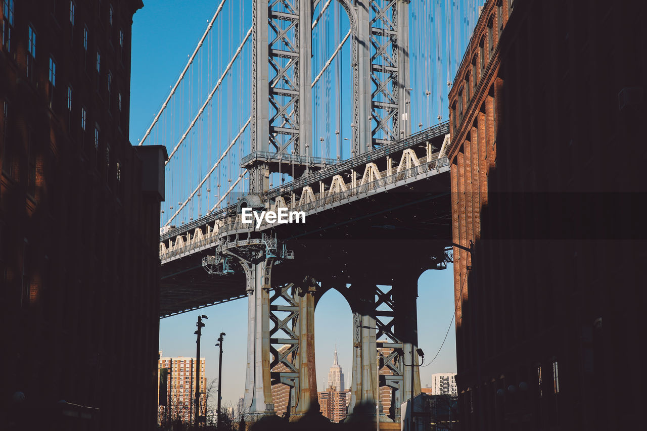 Low angle view of manhattan bridge against sky