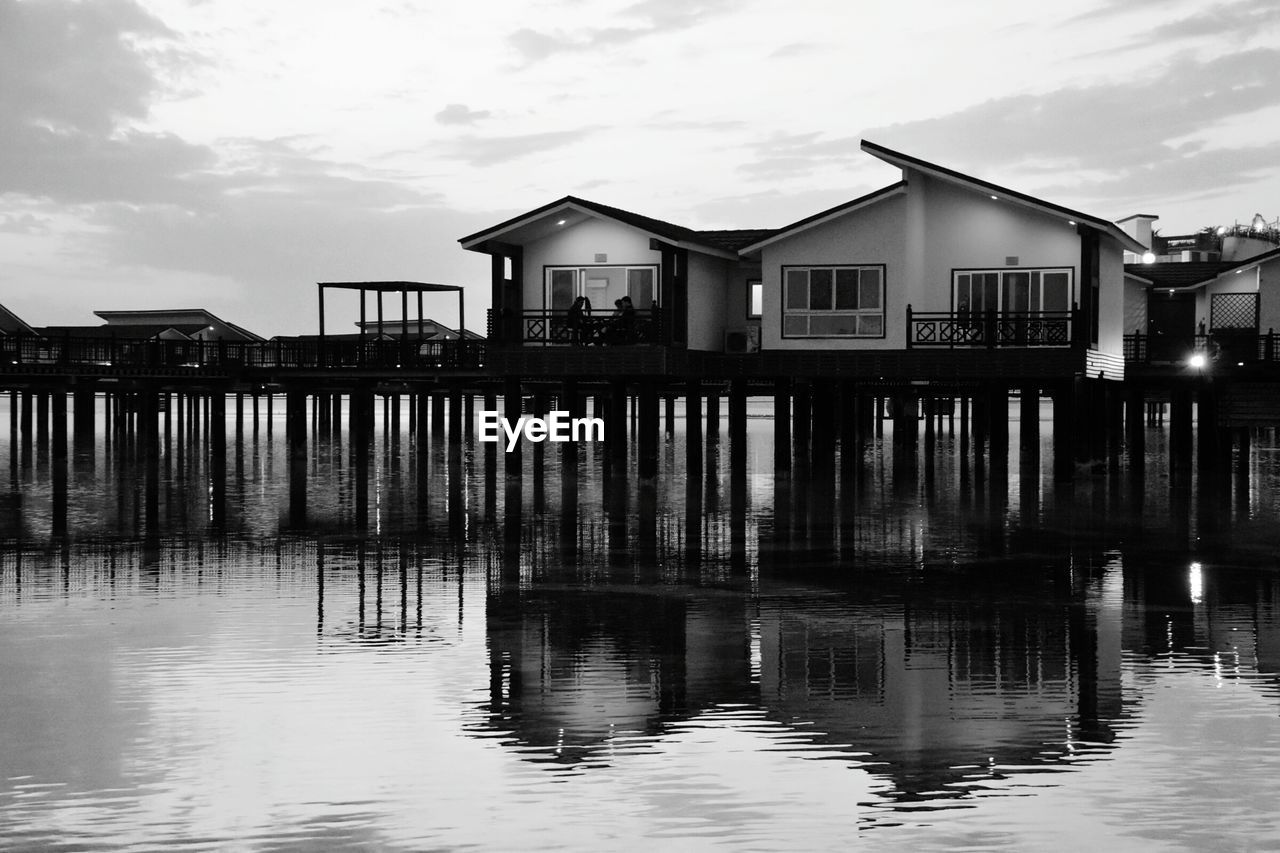 BUILT STRUCTURE ON SEA AGAINST SKY