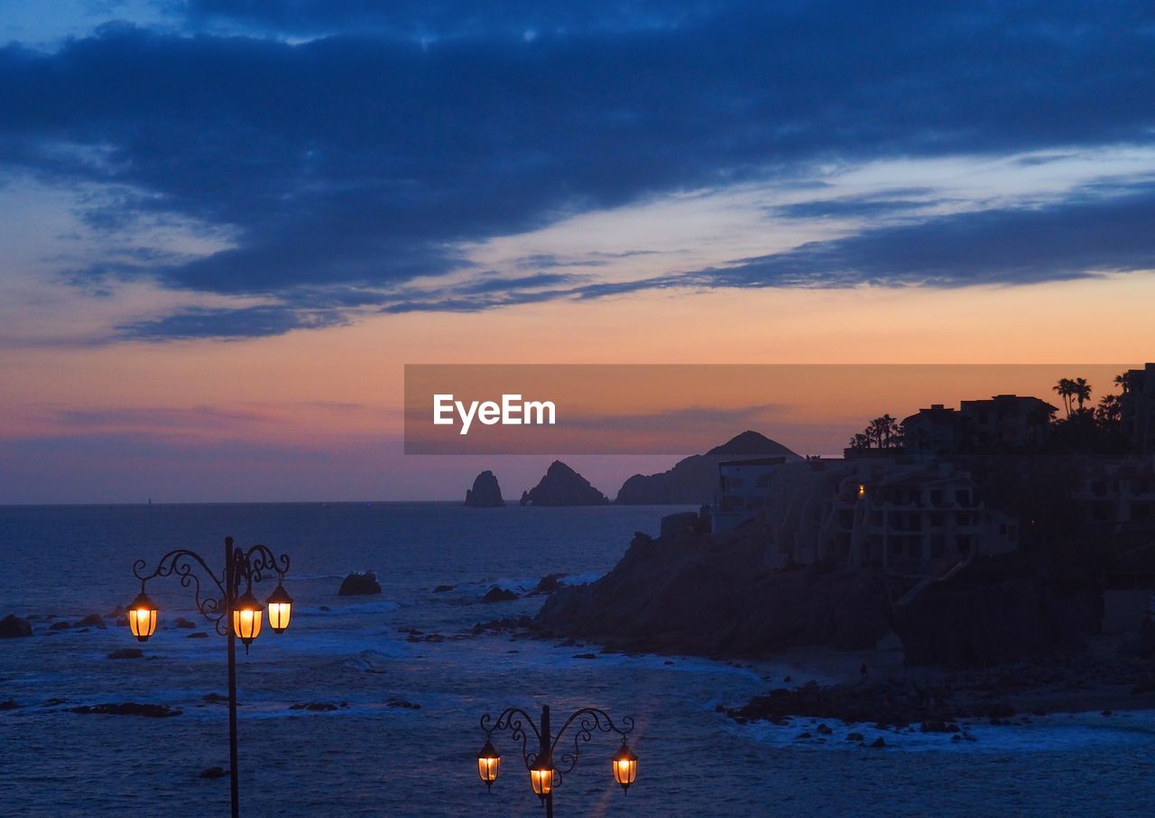 Scenic view of sea against sky at dusk