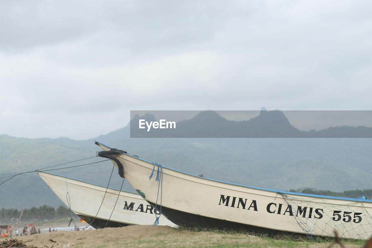 INFORMATION SIGN ON BOAT AGAINST SKY