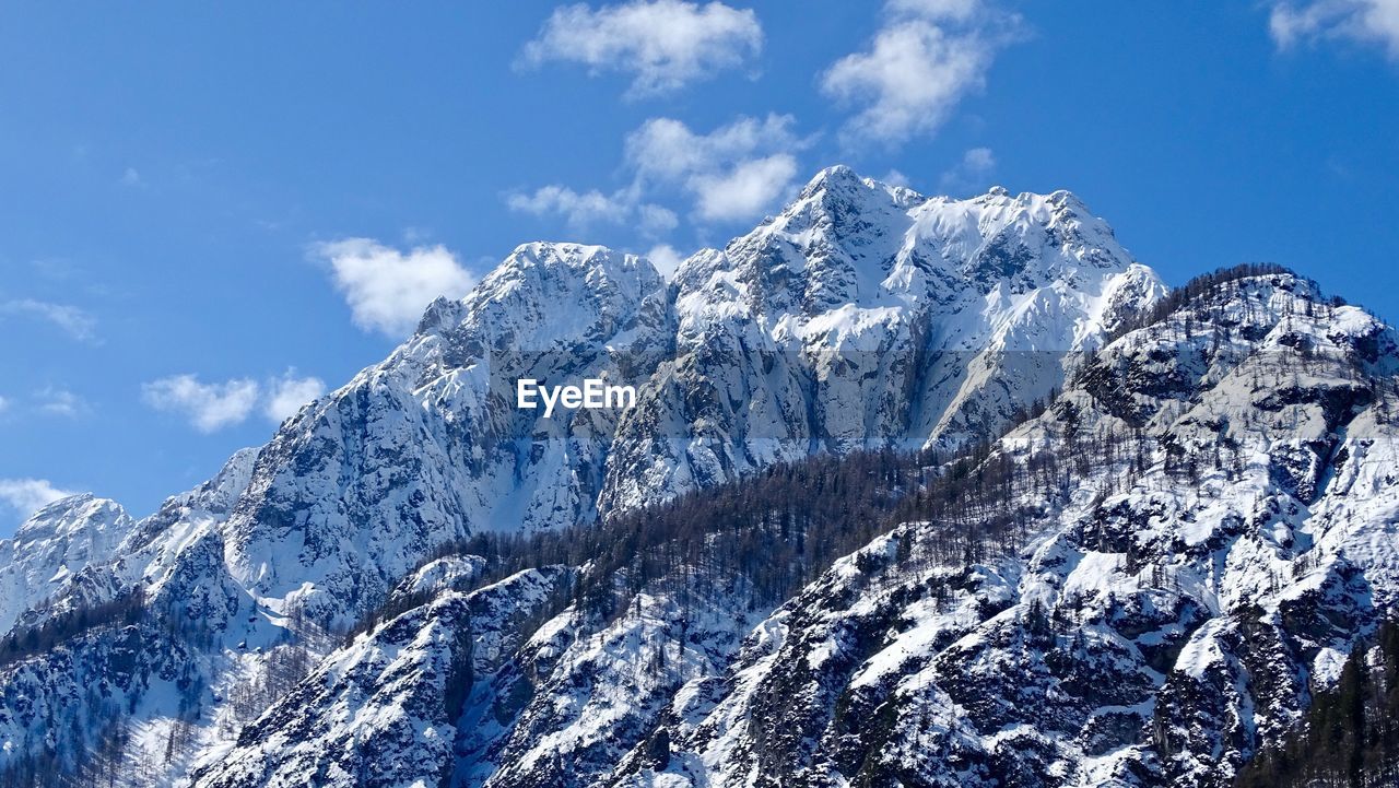 Snowcapped mountains against sky