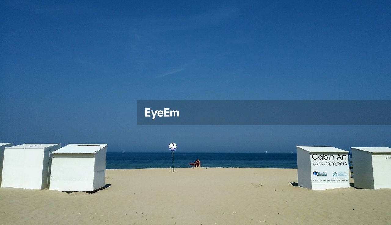 SCENIC VIEW OF BEACH AGAINST CLEAR SKY