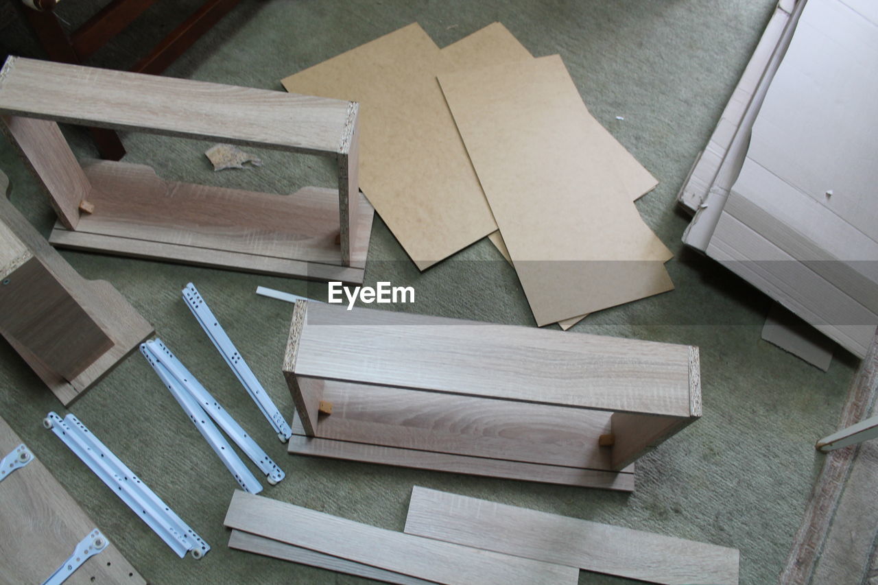 wood, indoors, high angle view, no people, floor, diy, paper, still life, furniture, business finance and industry, flooring
