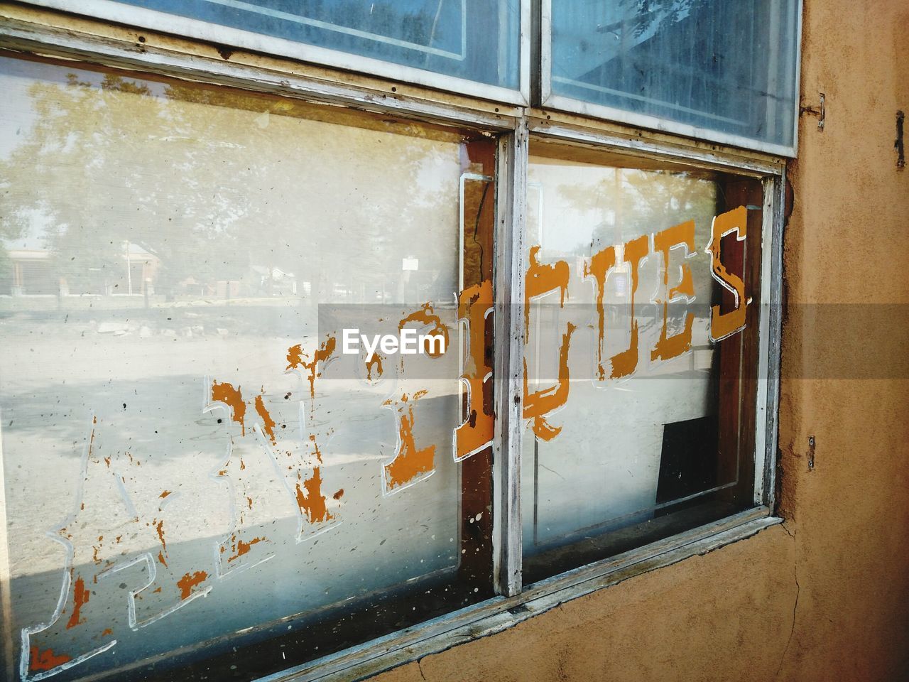 Text on glass window of building
