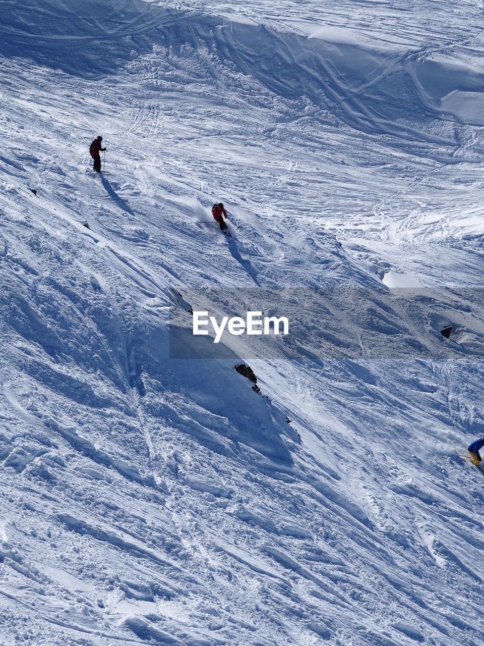 Tourists skiing in snow