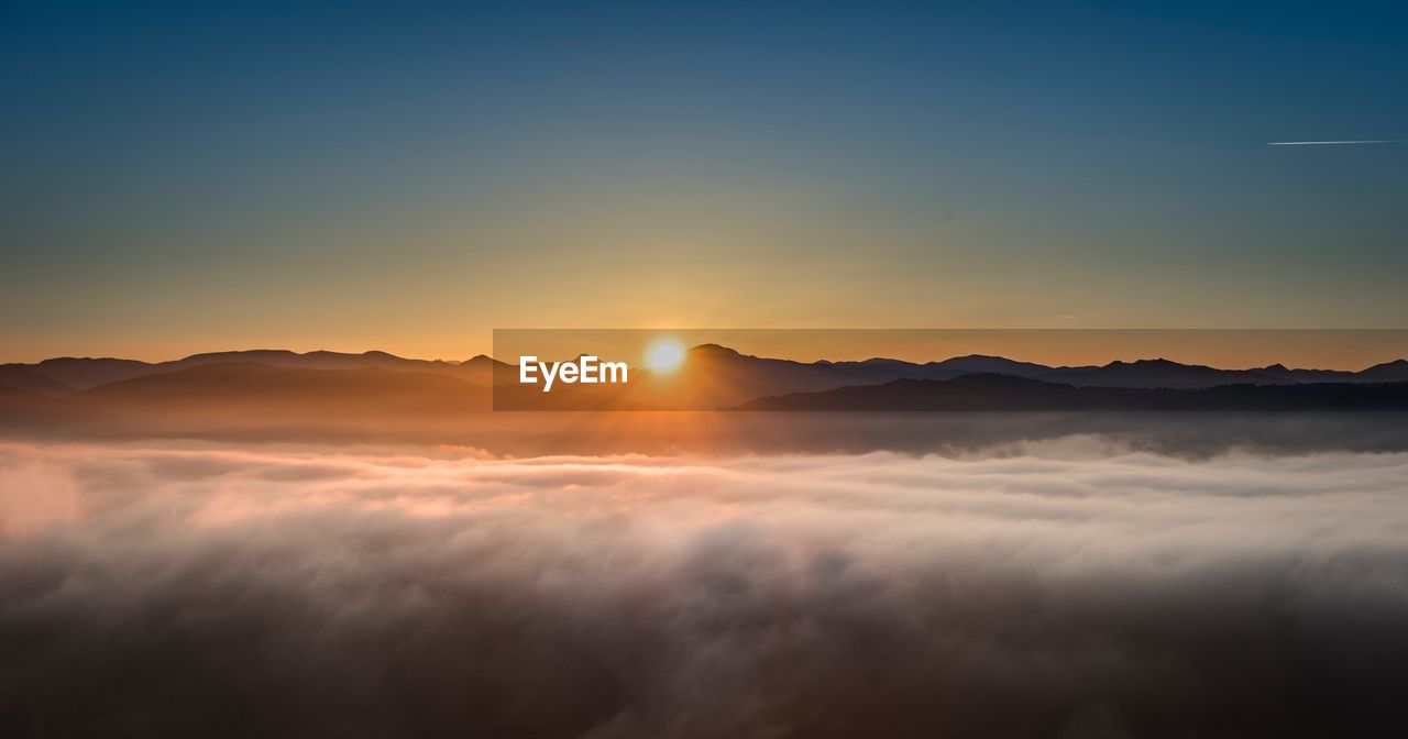 Scenic view of dramatic sky during sunset