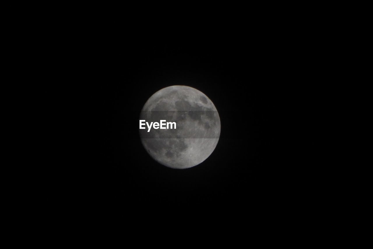 LOW ANGLE VIEW OF MOON AGAINST SKY