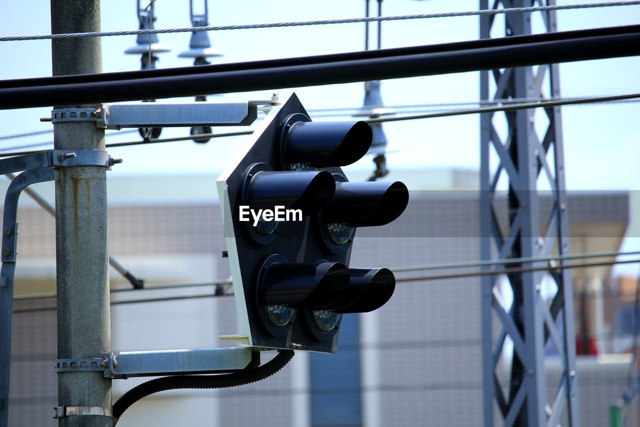 Close-up of coin-operated binoculars against sky