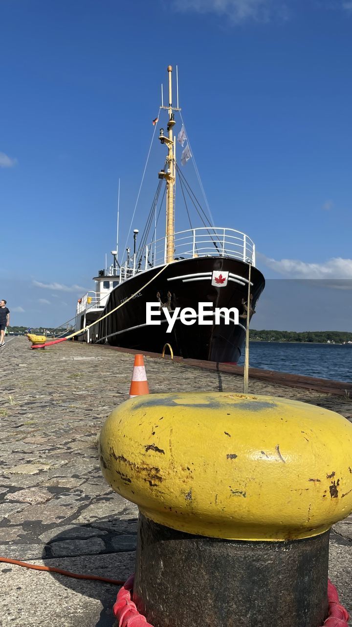 VIEW OF SAILBOATS MOORED ON PIER