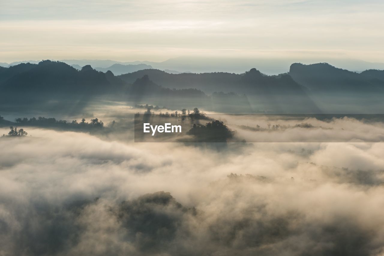 Scenic view of cloudscape and mountains against sky