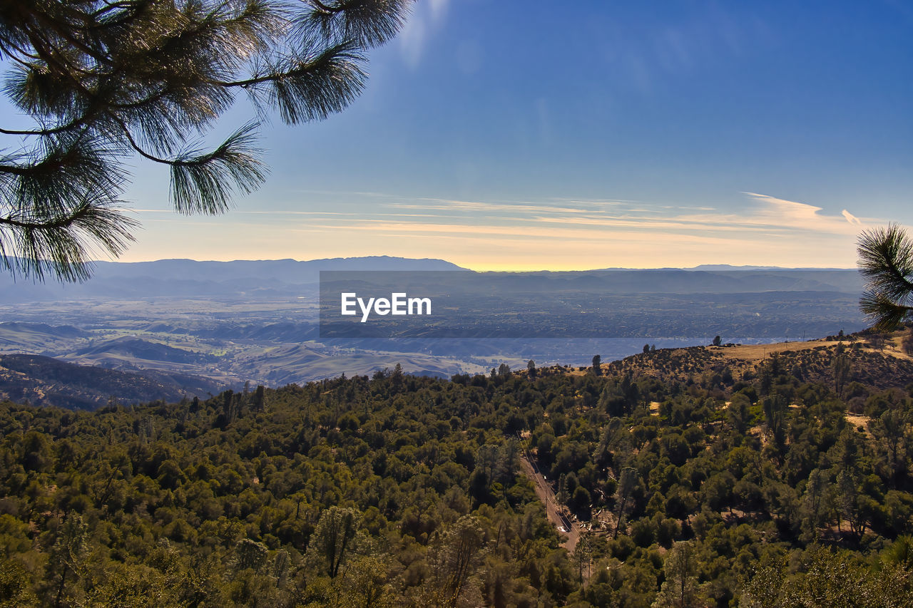 SCENIC VIEW OF LANDSCAPE AND MOUNTAINS AGAINST SKY