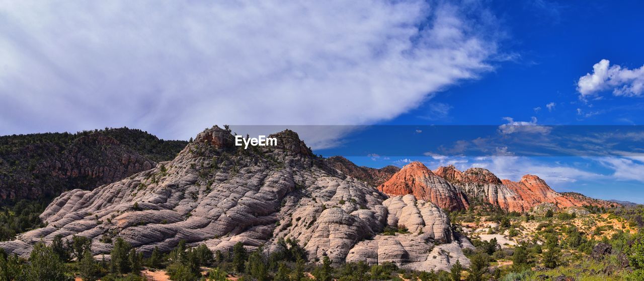 Panoramic view of rock formations against sky