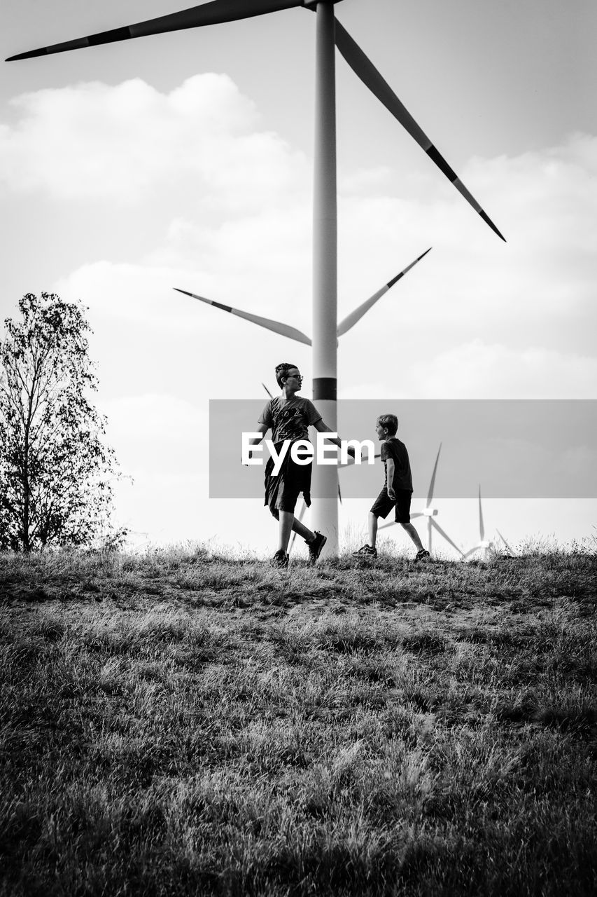 MEN STANDING ON FIELD