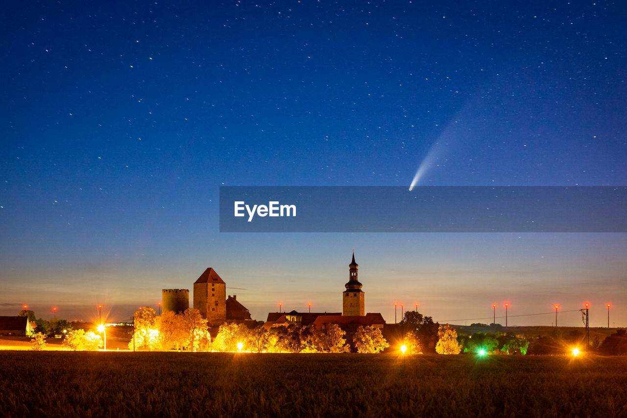 ILLUMINATED BUILDINGS AT NIGHT