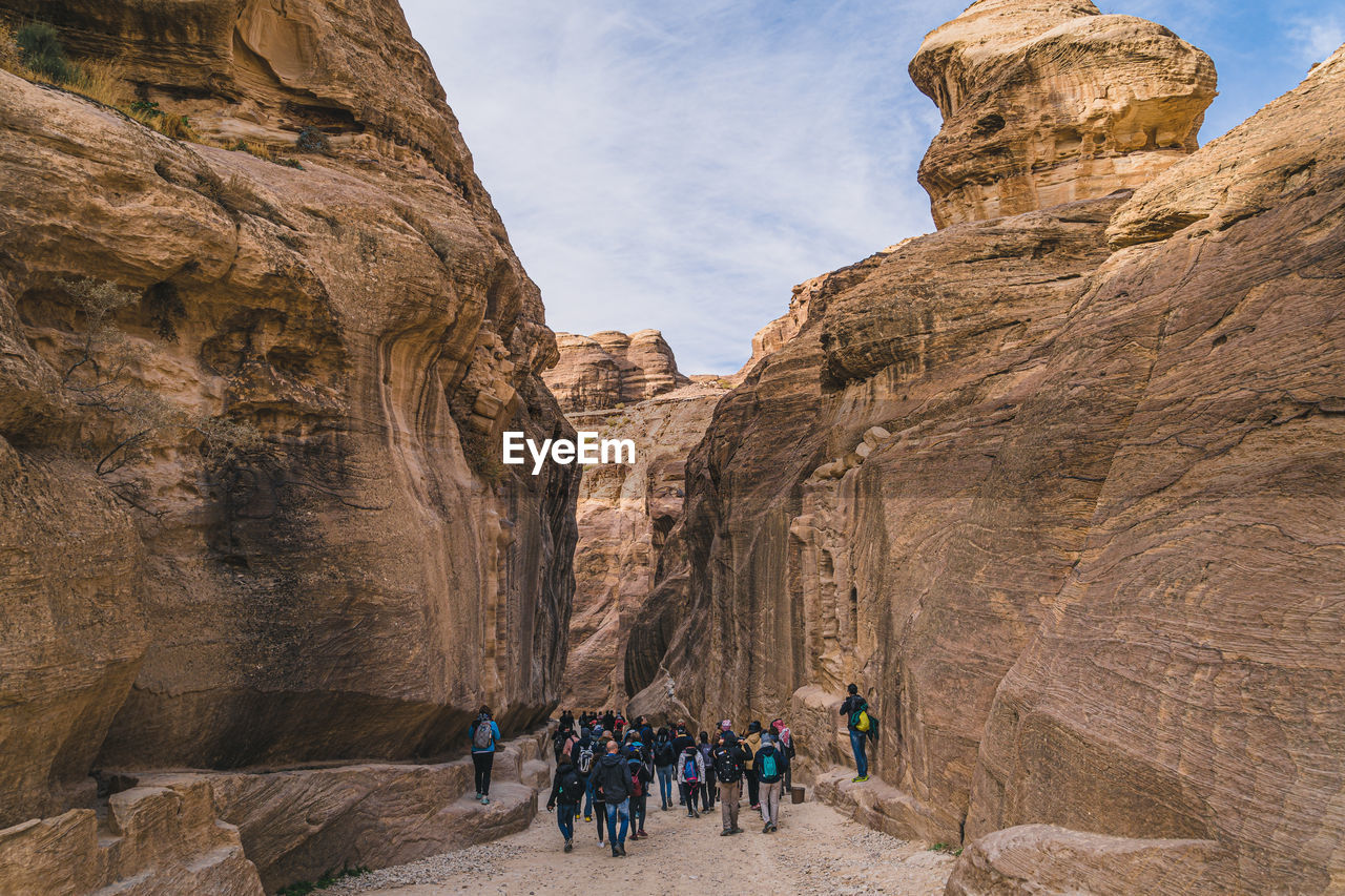Group of people walking in a canyon