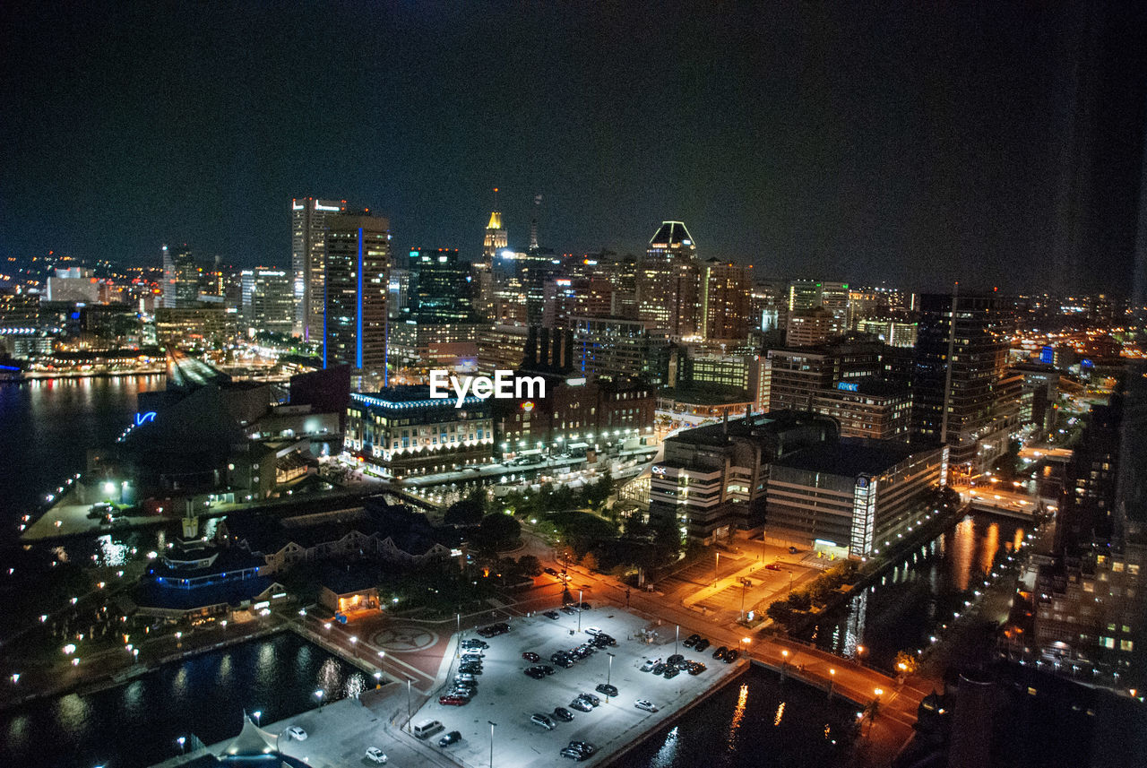 High angle view of illuminated buildings in city at night