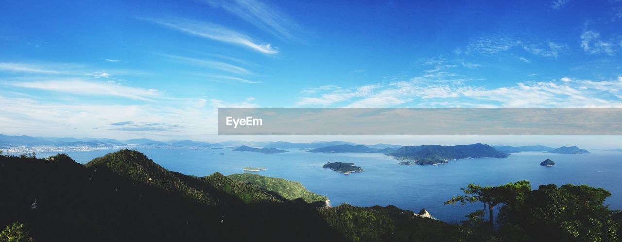 Panoramic view of mountains and river against sky