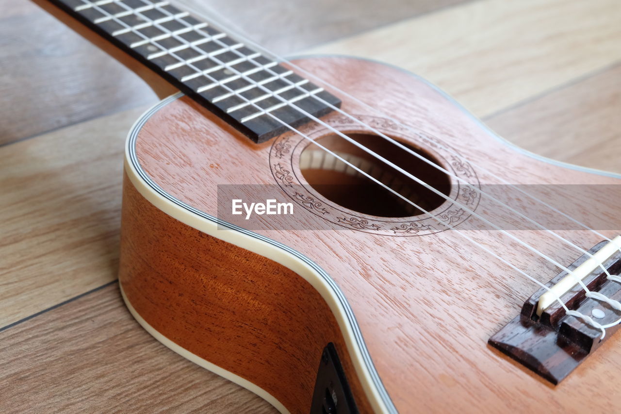 High angle view of guitar on table