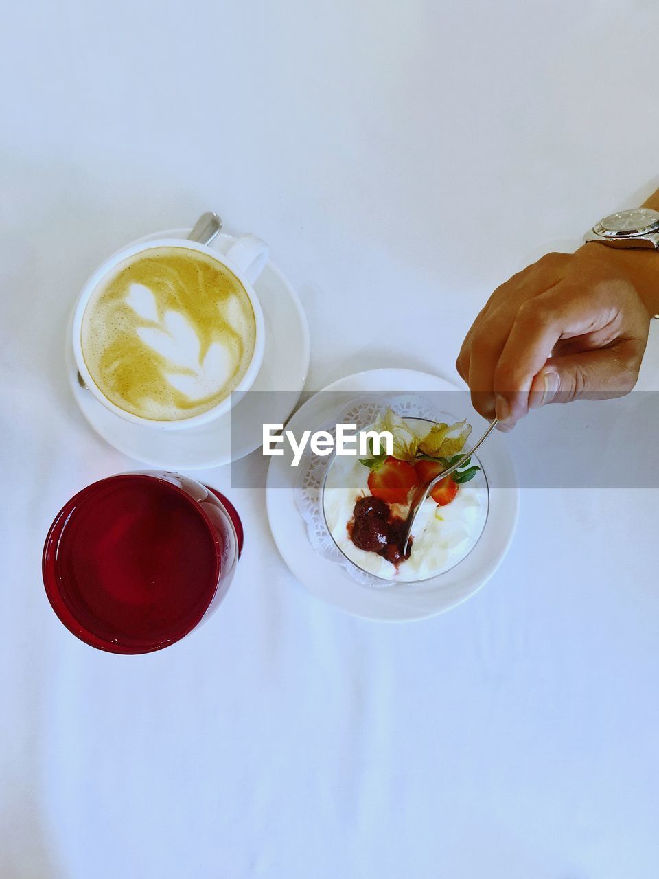 food and drink, food, indoors, hand, healthy eating, high angle view, fruit, meal, drink, freshness, wellbeing, refreshment, breakfast, one person, adult, produce, studio shot, glass, dish, holding, drinking glass