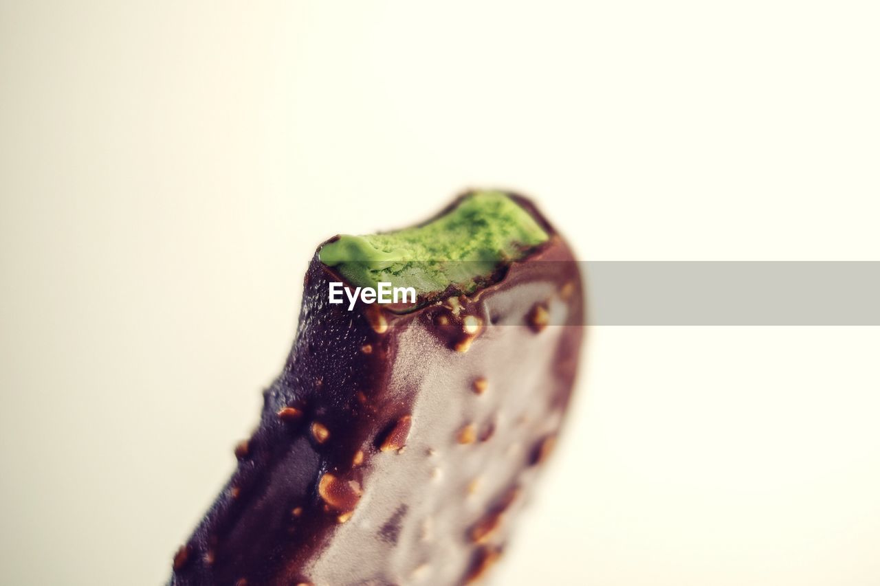 Matcha green tea ice cream pop with chocolate shell.