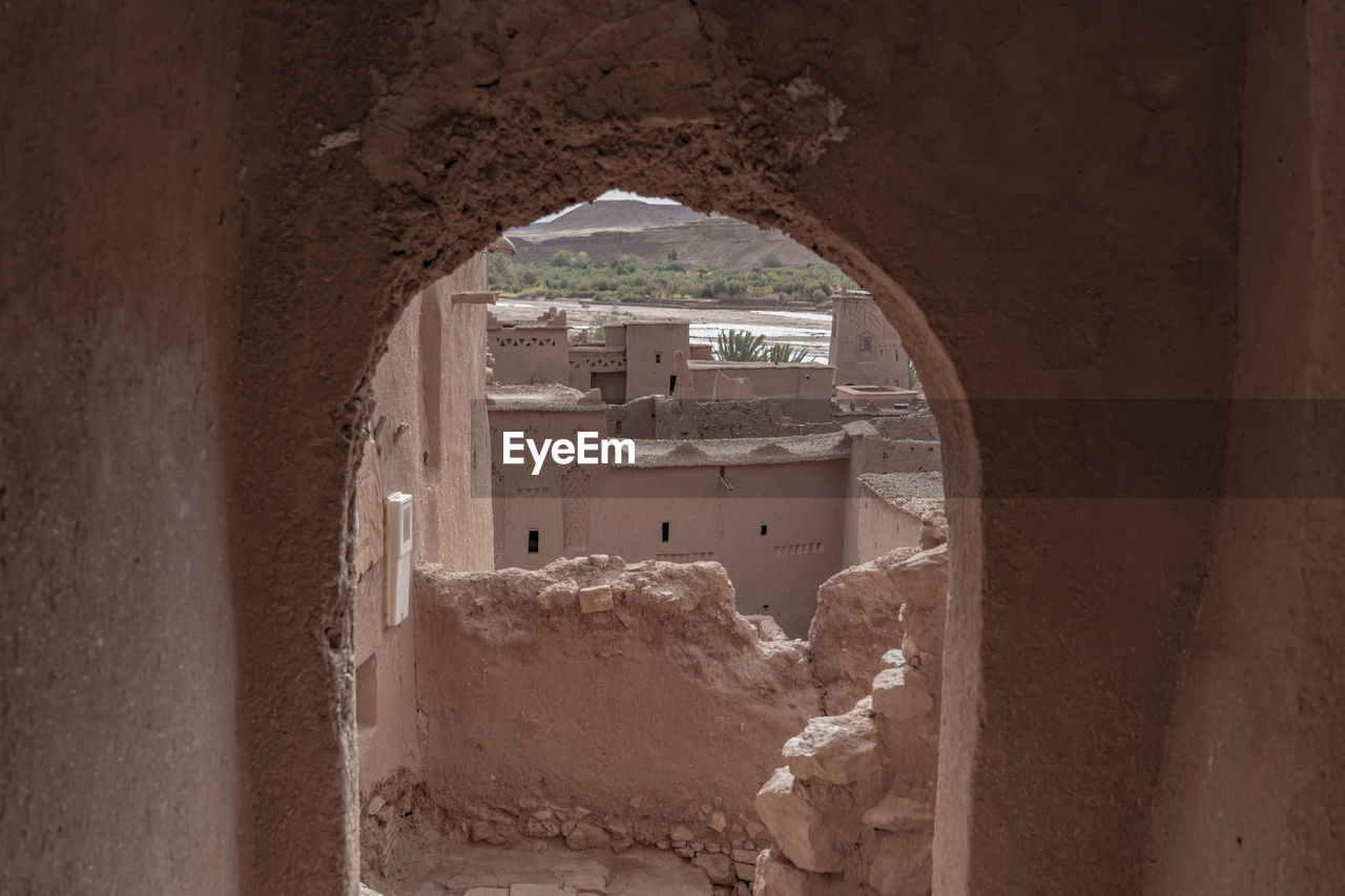 BUILDINGS SEEN THROUGH HOLE