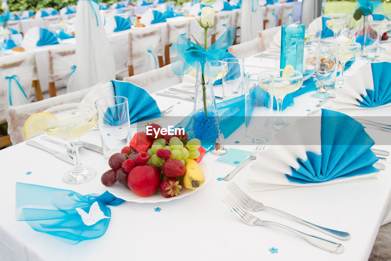 Luxury wedding lunch table setting outdoors, in white-blue colors