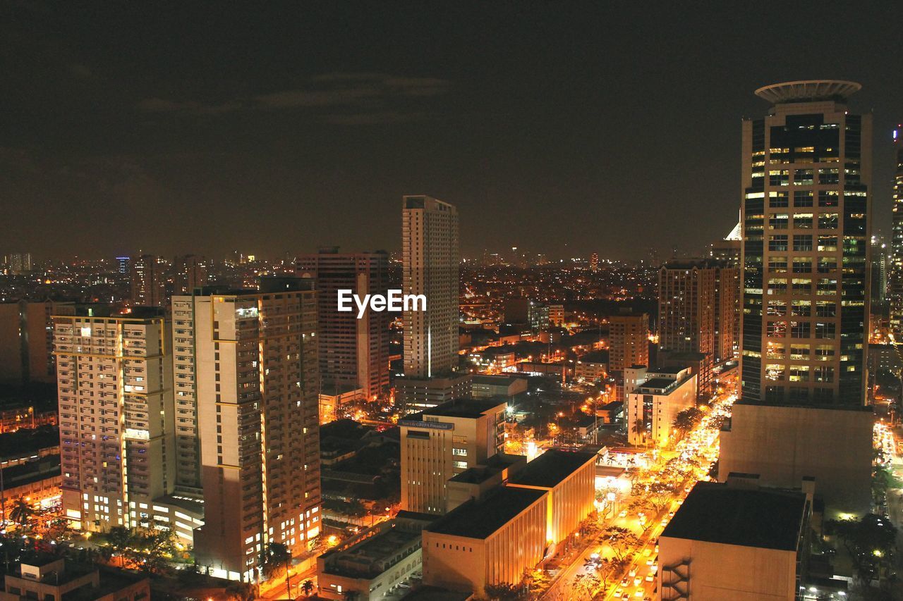 High angle view of cityscape against sky at night