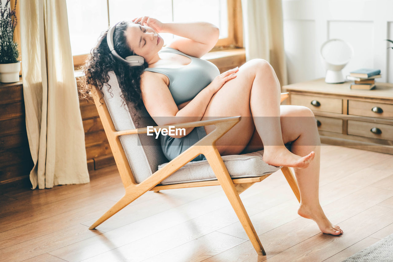 portrait of woman sitting on floor