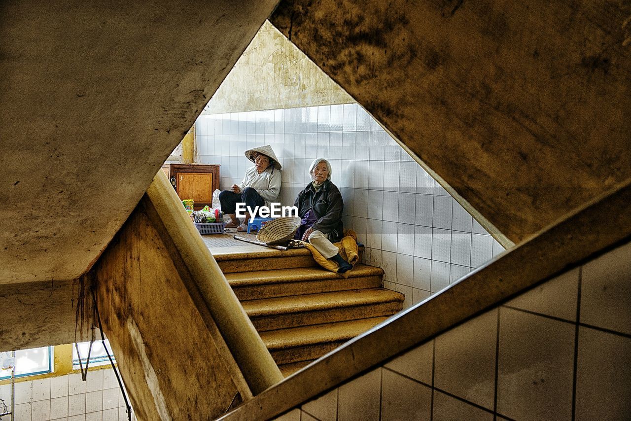 Senior couple sitting on steps