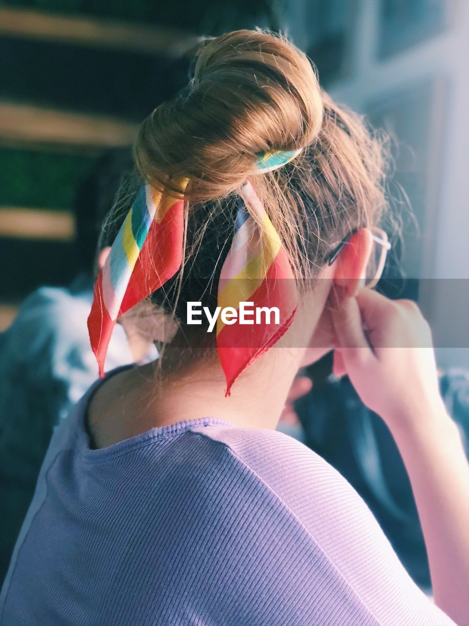 Close-up of woman with hair bun