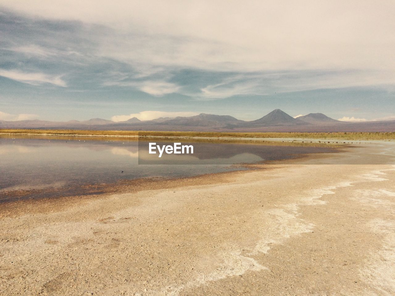 SCENIC VIEW OF MOUNTAIN AGAINST CLOUDY SKY