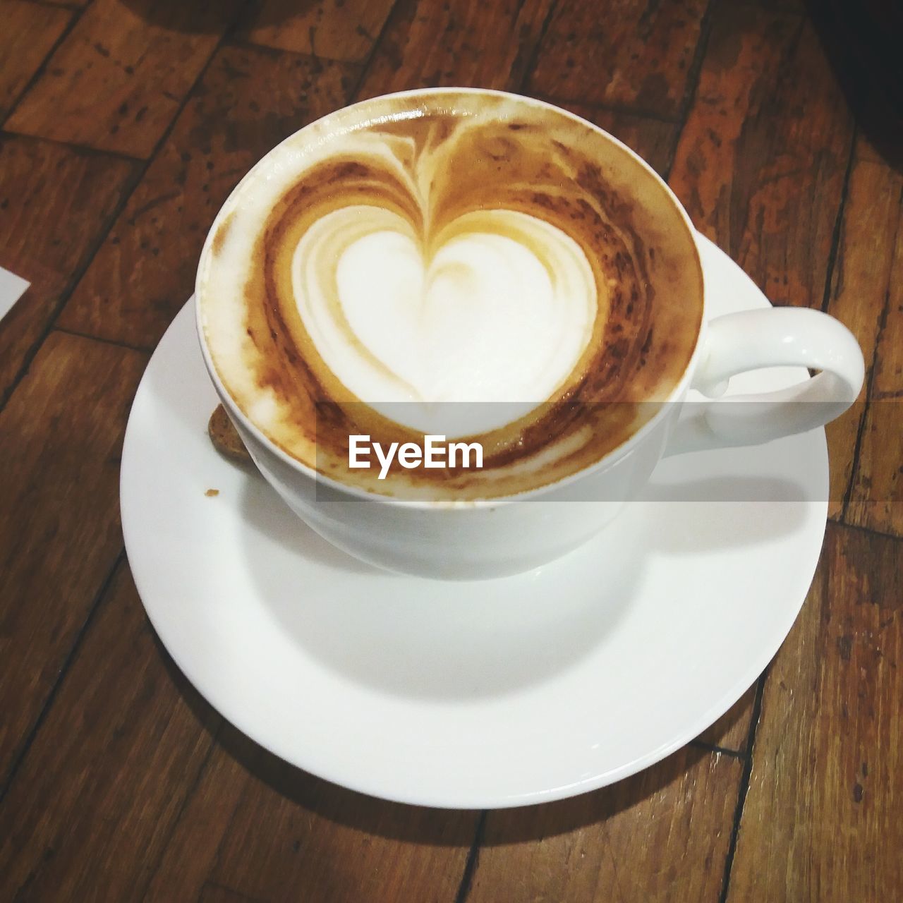 CLOSE-UP OF CAPPUCCINO SERVED ON TABLE