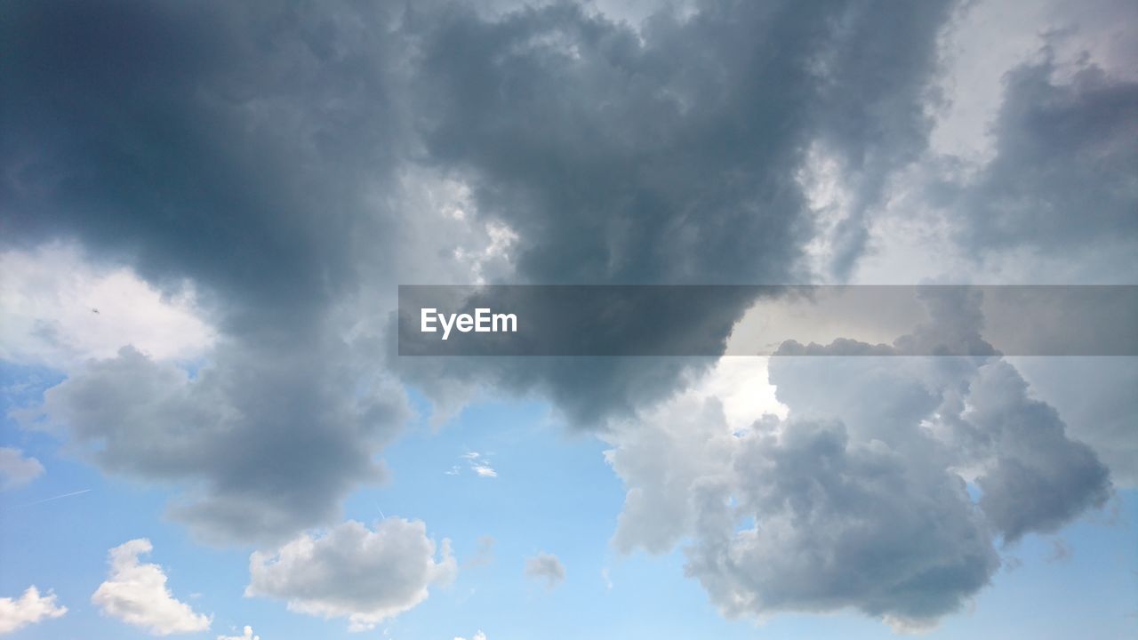 LOW ANGLE VIEW OF CLOUDY SKY OVER CLOUDS