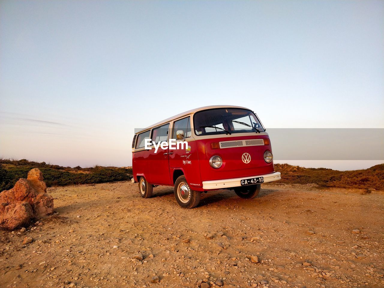 VIEW OF RED CAR ON ROAD