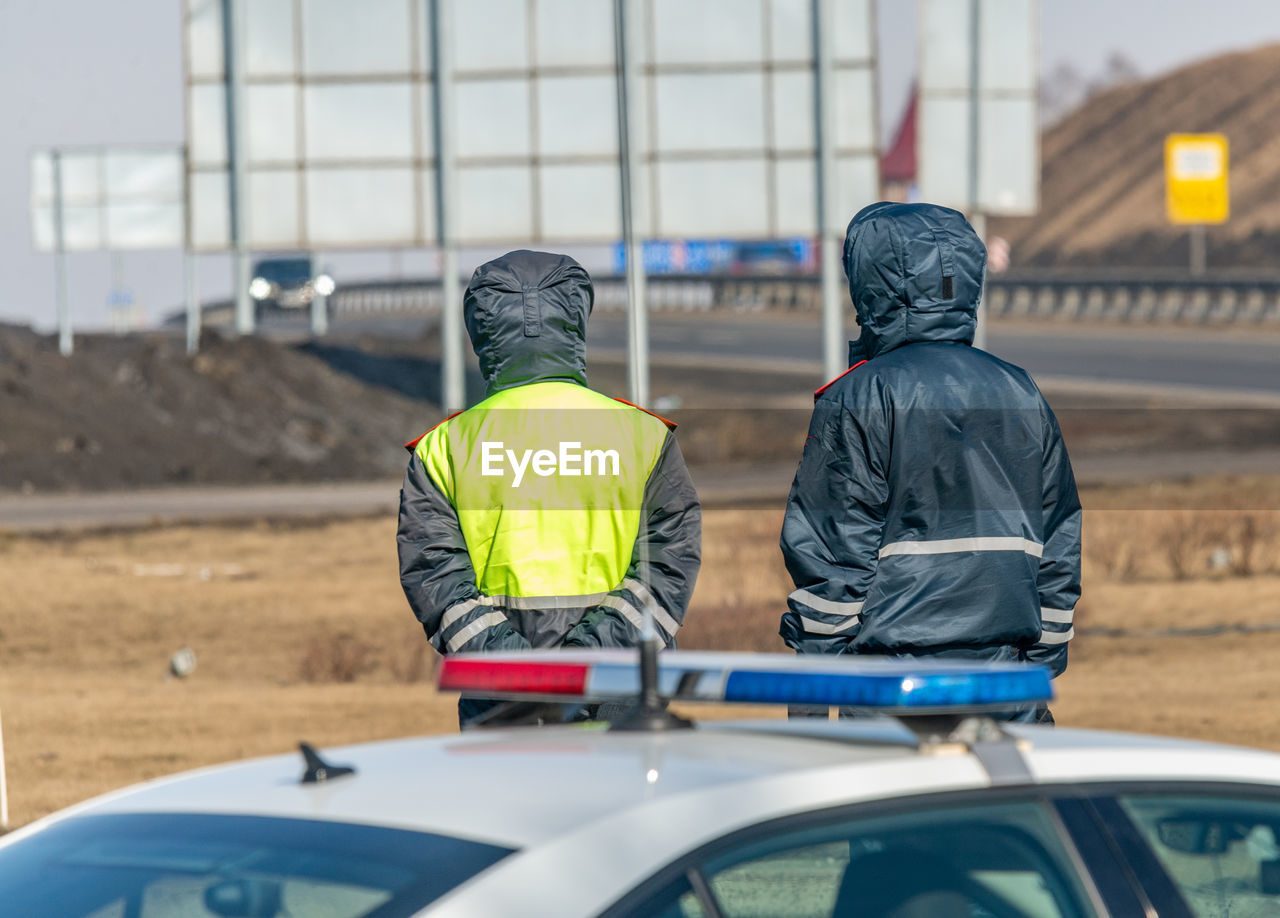 Traffic police officers monitor the movement of cars