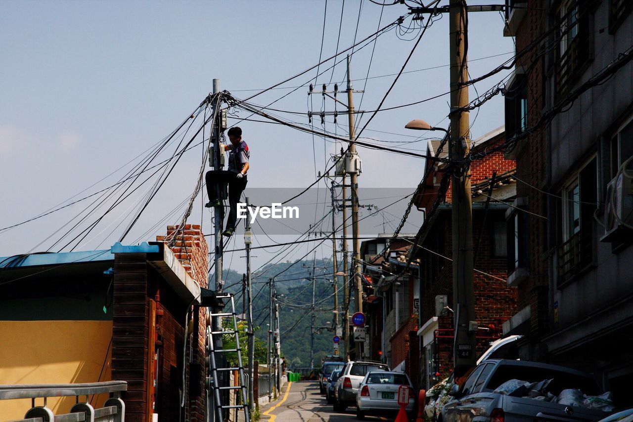 LOW ANGLE VIEW OF ELECTRICITY PYLON