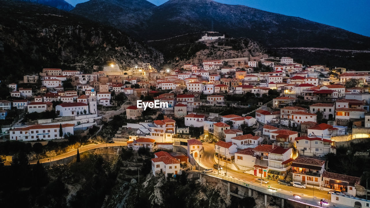 High angle shot of townscape against sky at night