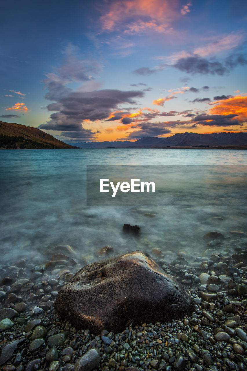 Scenic view of lake during sunset