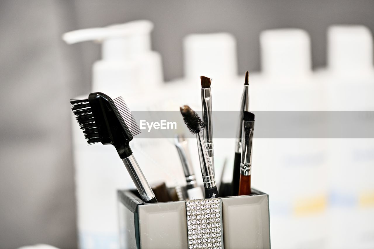 Close-up of make-up brushes in desk organizer