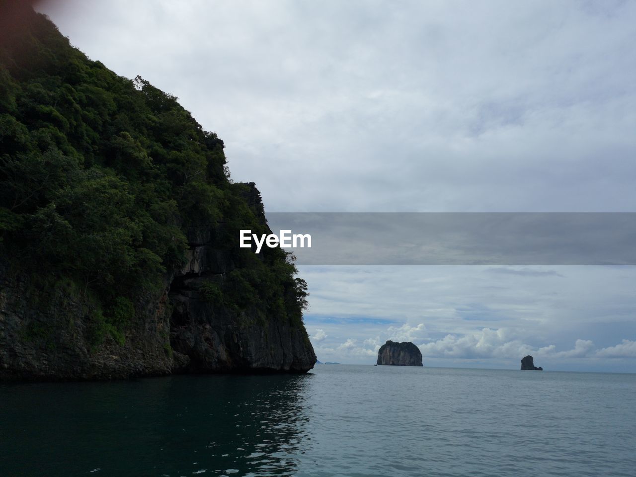 ROCK FORMATIONS BY SEA AGAINST SKY