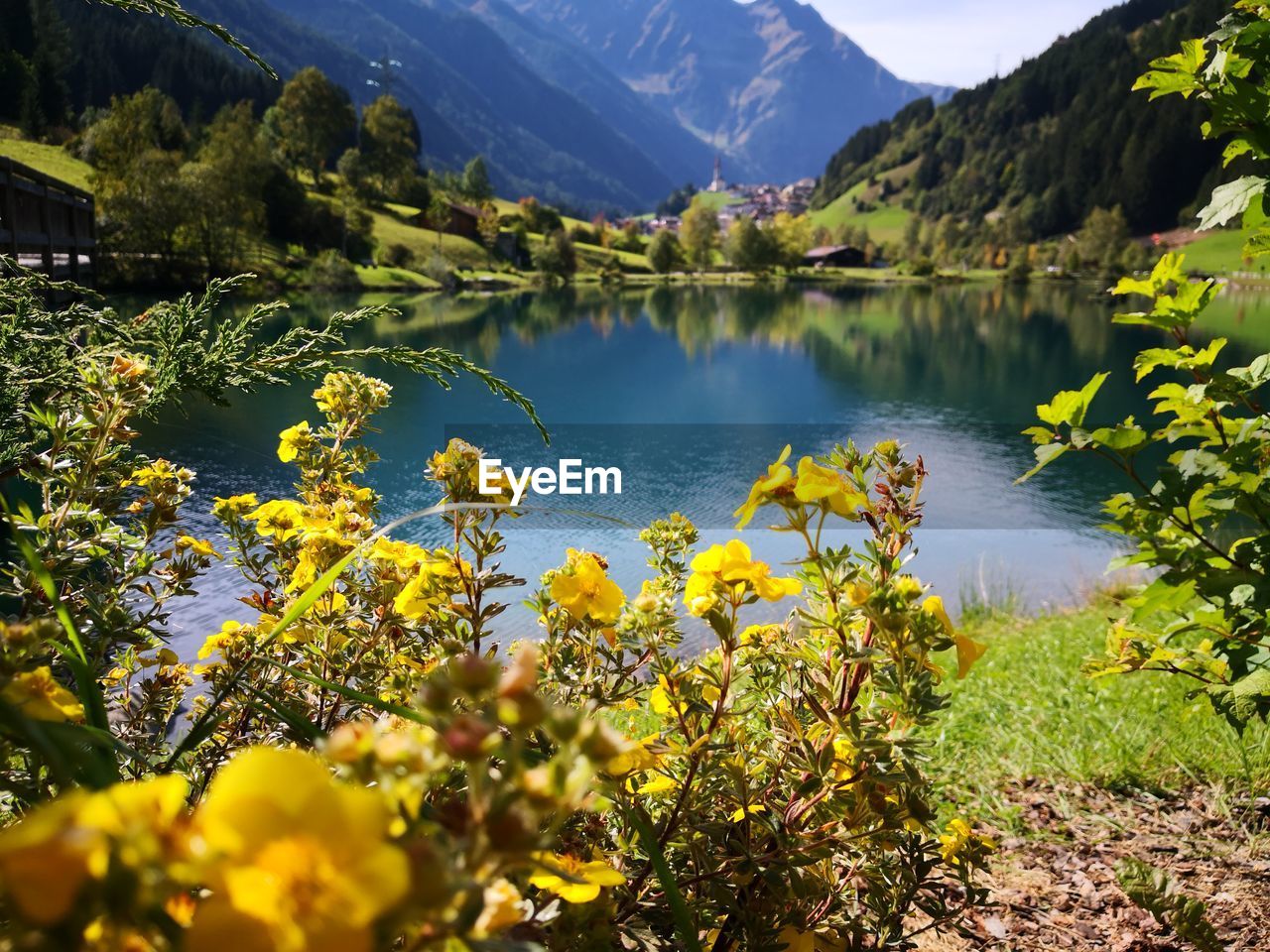 Scenic view of lake against cloudy sky