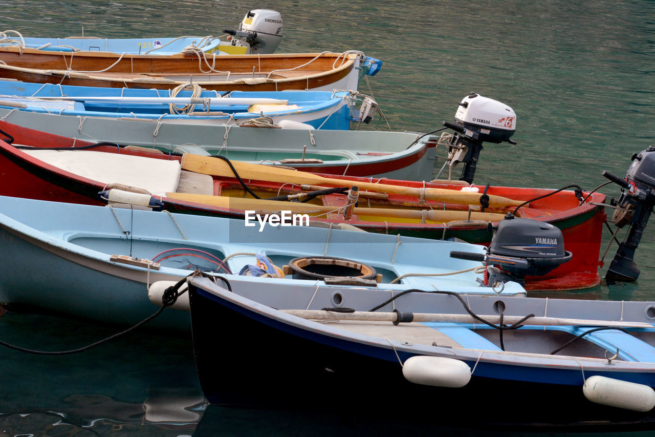 Boats moored on lake