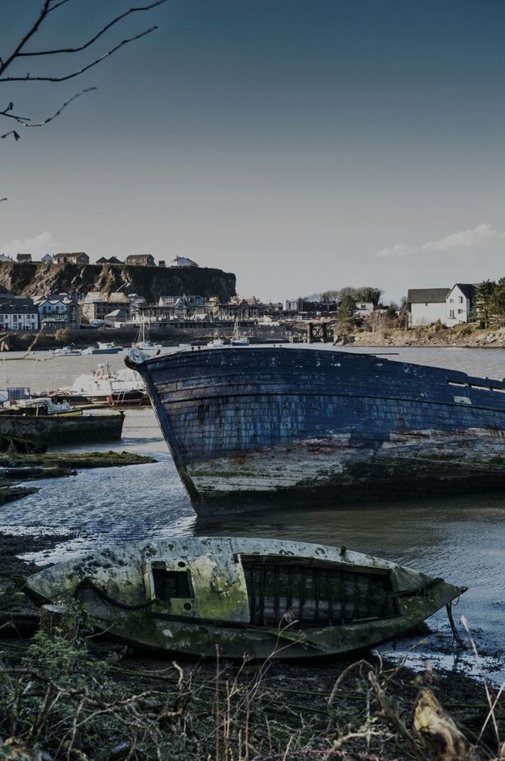 Abandoned boat at riverbank