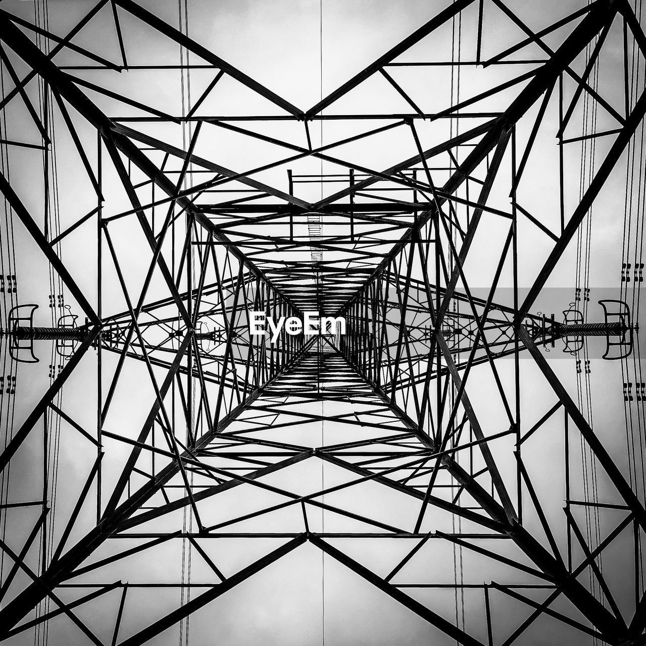 Low angle view of electricity pylon against sky