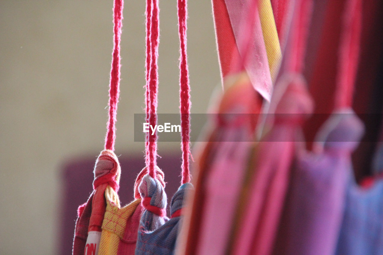 CLOSE-UP OF MAN HANGING ON OUTDOORS