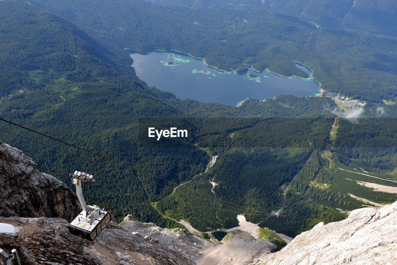 HIGH ANGLE VIEW OF TREES AND MOUNTAIN