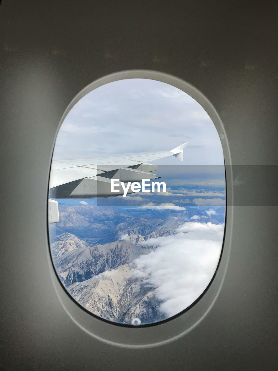 Aerial view of sea seen through airplane window