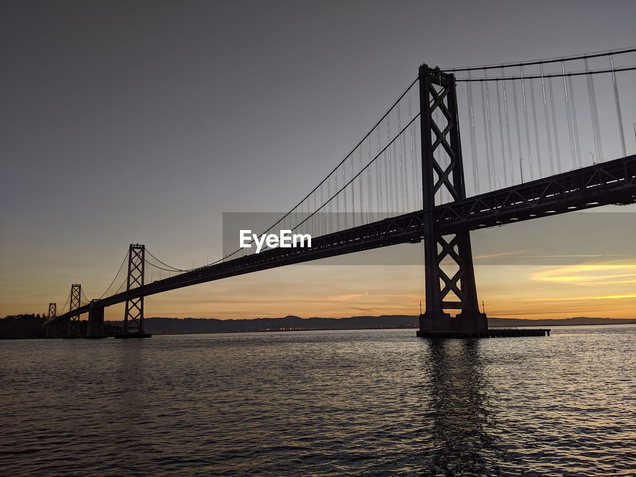 SUSPENSION BRIDGE AT SUNSET