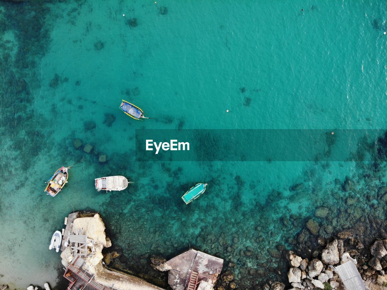 High angle view of rocks in sea