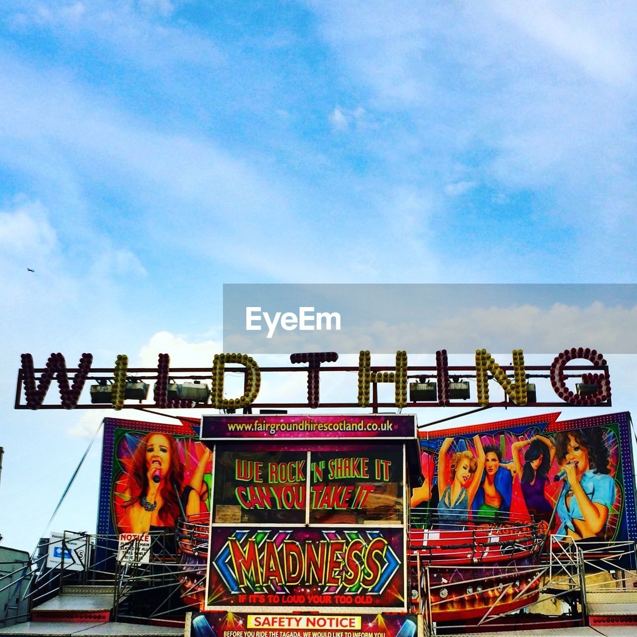 LOW ANGLE VIEW OF FERRIS WHEEL AGAINST SKY